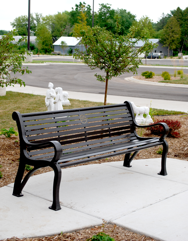 Example of an outdoor memorial bench with plaque. 